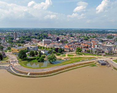 Aerial  from the town Tiel at the river Waal in a flooded landscape in the Netherlands clipart