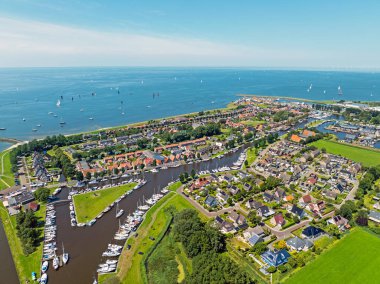 Aerial from the historical city Stavoren at the IJsselmeer in the Netherlands in summer clipart