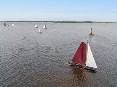 Aerial from the Fryske Praem sailing competition on the Heegermeer in the Netherlands clipart