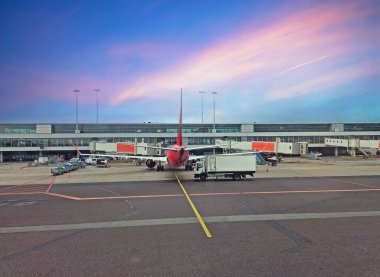 Airplane getting ready for departure on Schiphol airport in the Netherlands clipart