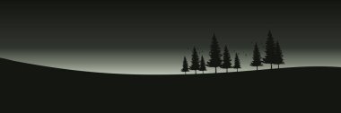Karanlık arka planda dağları olan ağaçların silueti