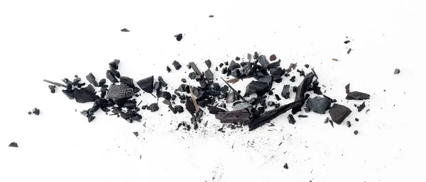 stock image Black charcoal particles isolated on a white background, Activated charcoal powder