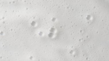 Soyut arka plan beyaz sabunlu köpük dokusu. Köpüklü şampuan köpüğü.