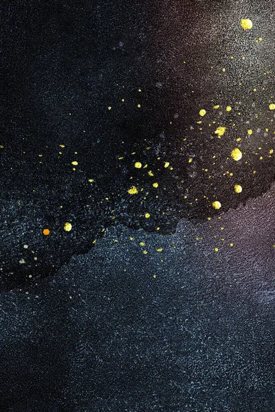 Gold splatter on dark blue texture background