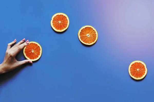 Delicious orange citrus fruit slices flat lay background