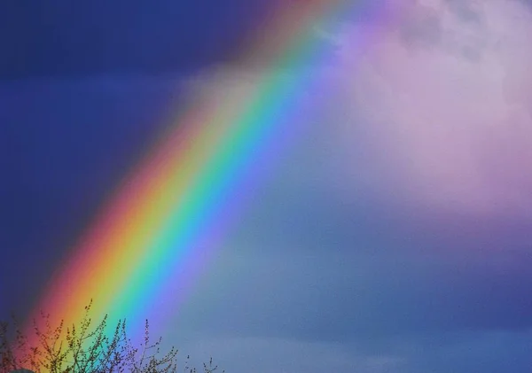 Rainbow in cloudy sky