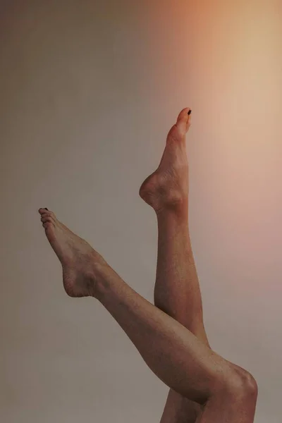 Attractive female legs up in the air