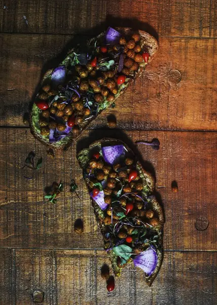 Stock image Homemade organic chickpea toast on a wooden plate