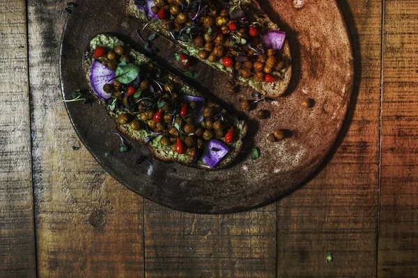 stock image Homemade organic chickpea toast on a wooden plate