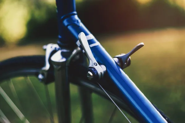 Closeup of blue urban racing bicycle brake system