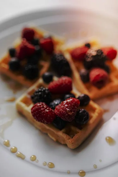 Homemade waffle with berries topping