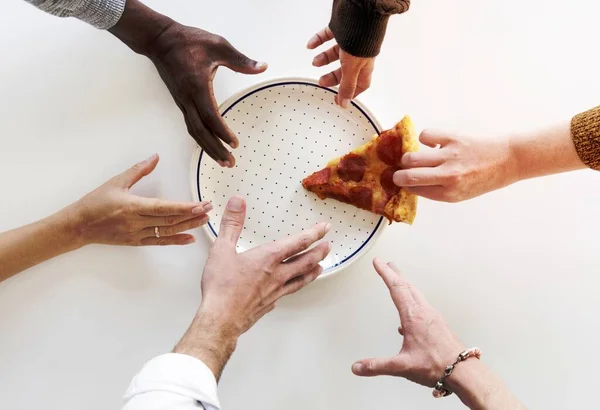 Stock image People Hands Grabbing Last Slice of Pizza