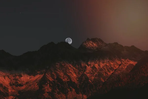 stock image A Moon above the Mhlwald commune in South Tyrol,  Italy