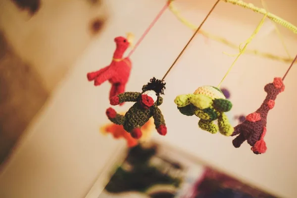 stock image Toy hanging over baby's bed