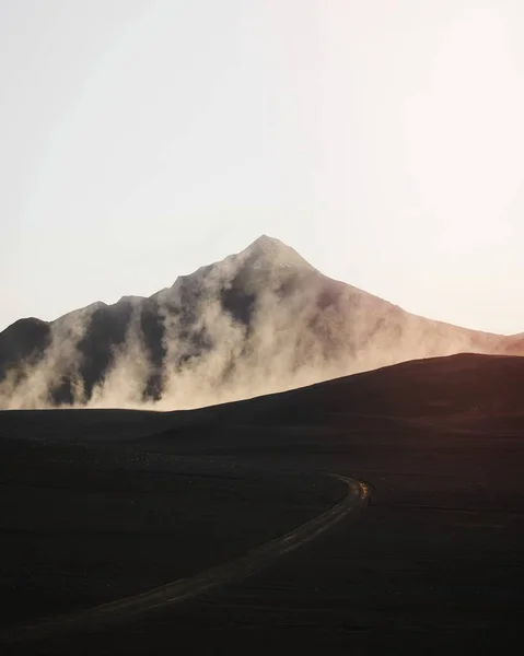 stock image Curve road with a misty volcanic drone shot