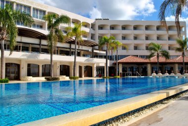 Beach hotel with palm trees