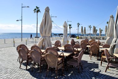 chairs and tables on the beach cafe