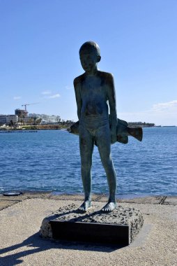 Monument with child and fish