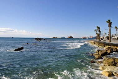 A child holding a fish statue