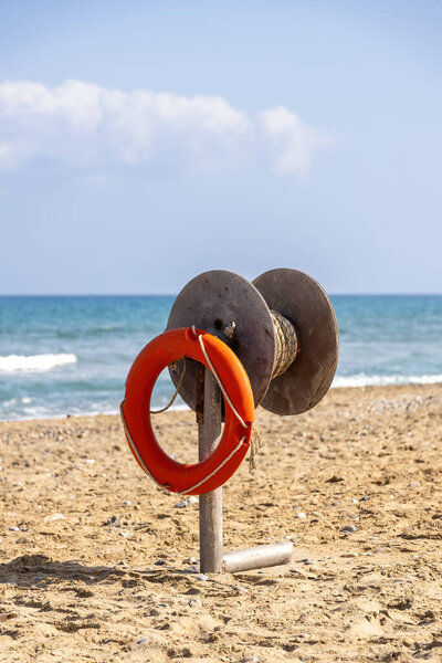 Lifebuoy with throwing device on the beach of Crete, Greece