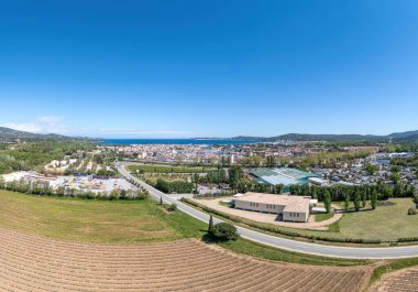 Panorama, Port Grimaud harbor in France in springtime with yachts and sailboats and Mediterranean Sea in the evening, drone shot, Cote d'Azur clipart