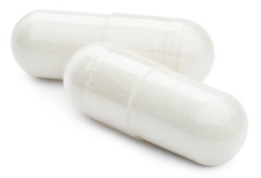 Tıbbi kapsüller ya da haplar beyaz arka planda izole edilmiş. Kırpma yolu ile hap. Vitamin takviyesi hapı ya da uyuşturucu