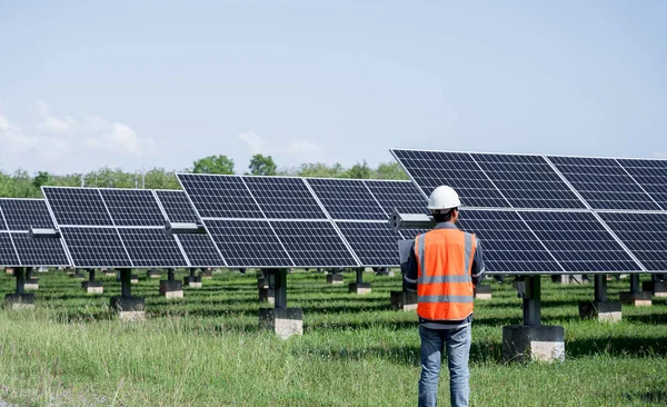 The solar farm(solar panel) with engineers check the operation of the system, Alternative energy to conserve the world\'s energy, Photovoltaic module idea for clean energy production.