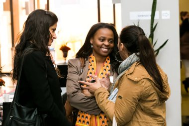 Johannesburg, South Africa - July 14, 2014: Diverse woman networking at corporate convention event