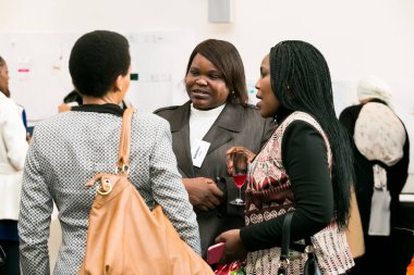 Johannesburg, South Africa - July 14, 2014: Diverse woman networking at corporate convention event