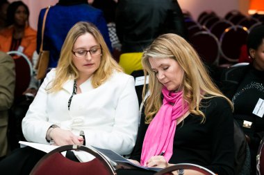 Johannesburg, South Africa - July 14, 2014: Diverse woman networking at corporate convention event