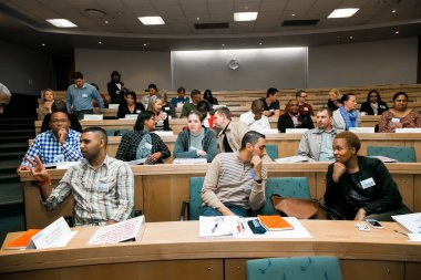 Johannesburg, south Africa - August 31, 2014: Diverse students attending a lecture in College Auditorium