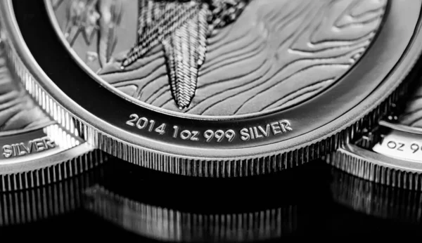 stock image Macro Close up of  Silver Bullion Coin on a black mirror background