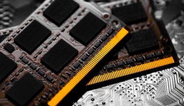 Macro Close up of computer RAM chip and motherboard on dark background clipart