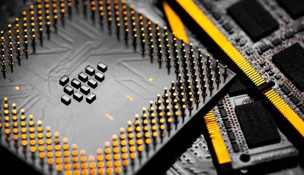 Macro Close up of RAM Memory and pins on Main CPU PC processor circuit board.	