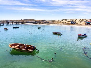 Port Nolloth, South Africa - March 16, 2024: Small fishing rowboats in harbour in coastal town clipart