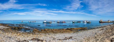 Port Nolloth, South Africa - March 16, 2024: Marine Diamond mining boats offshore in small coastal town clipart