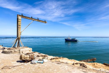 Port Nolloth, South Africa - March 16, 2024: Old jetty harbour in small coastal town clipart