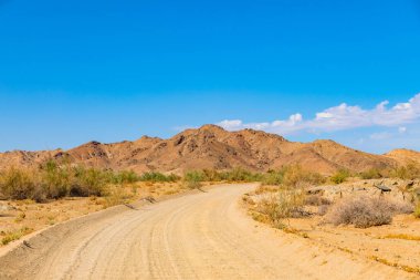 Gravel dirt road in the Richtersveld National Park, arid area of South Africa clipart