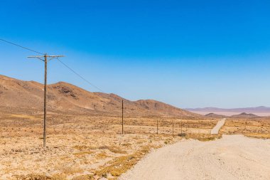 Arid landscape road in the Richtersveld National Park, South Africa clipart