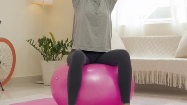 Tilt Shot Woman Doing Overhead Tricep Extension Dumbbells Exercise Ball — Vídeos de Stock