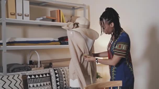 African American Female Dressmaker Using Measuring Tape While Working Cardigan — Video Stock