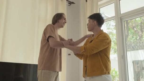 Two Best Mates Shaking Hands Embracing Gathering Together Indoors — Vídeo de Stock