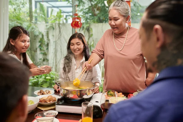 Grandmother Putting Cooked Corn Plate Preteen Girl Family Dinner — Stok fotoğraf