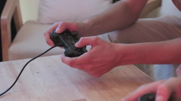 Two Unrecognizable Boys Pressing Buttons Controllers While Playing Video Games — Αρχείο Βίντεο