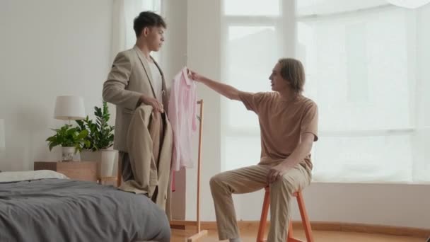 Two Caucasian Guys Choosing What Wear Night Out Standing Clothes — 图库视频影像