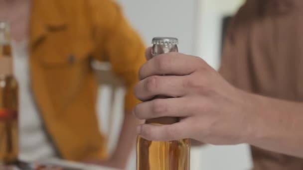 Closeup Guy Opening Beer Bottle Toasting Male Friend Hanging Out — Stock videók
