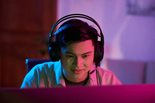 Smiling Teenage Boy Wearing Headset Playing Videogame Home — Foto Stock
