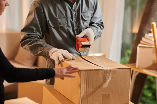 House Owner Controlling Mover Sealing Cardboard Boxes — Stok fotoğraf
