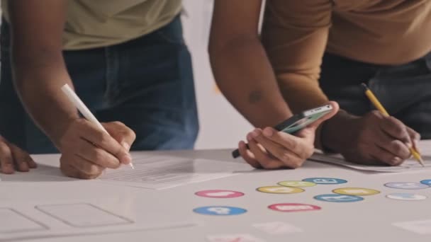 Cropped Shot Team Mobile App Developers Holding Smartphone Making Notes — Stockvideo