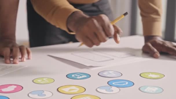 Close Shot Male Designers Discussing Icons Taking Notes Wireframe Sketches — Vídeo de Stock